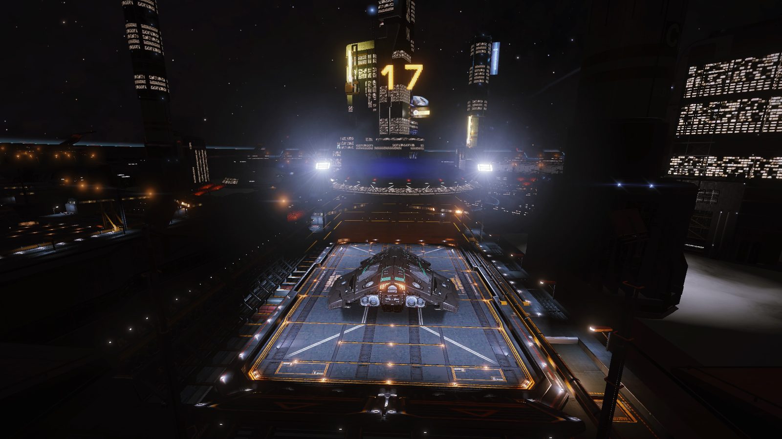 Well-lit station with ship on landing pad, good scale and detail.