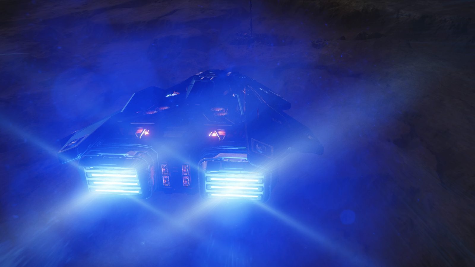 Close-up of ship thrusters with intense blue lighting.