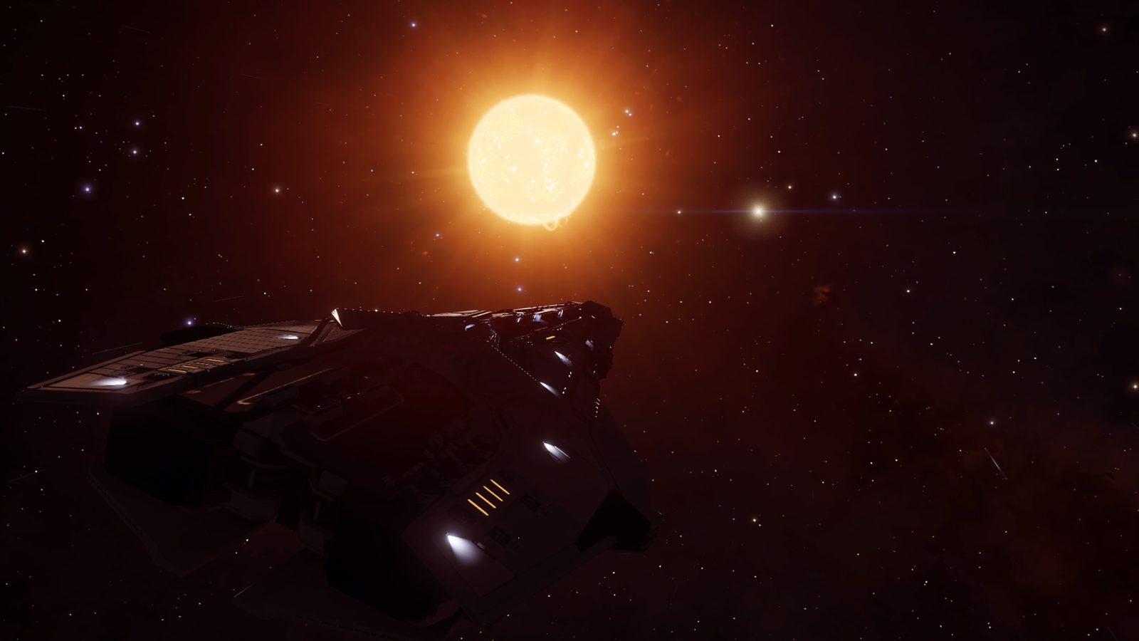 Ship silhouette against bright star with space background.